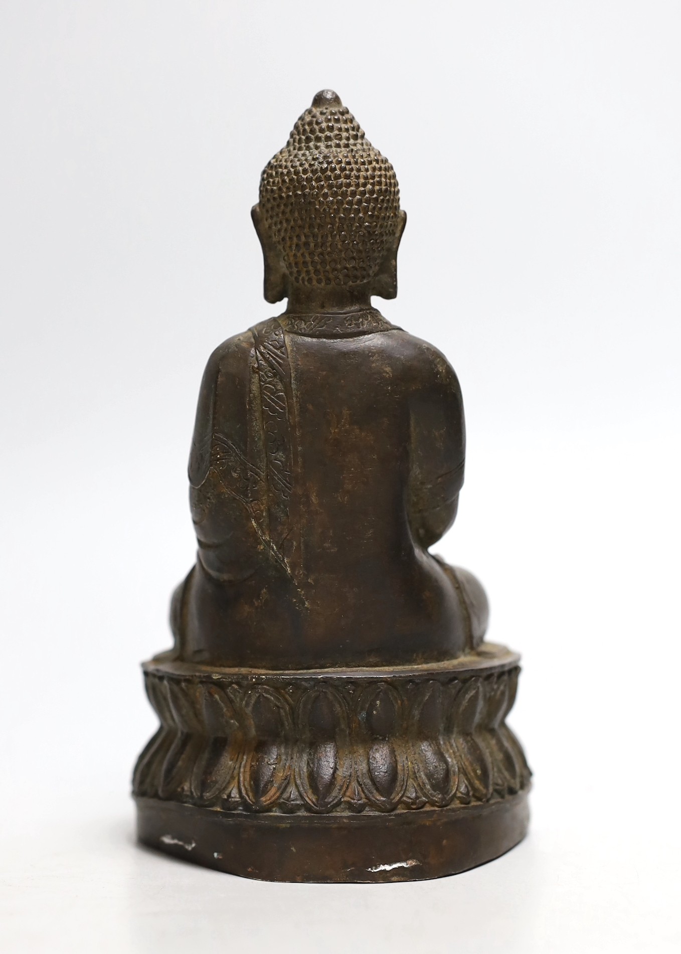 A bronze seated figure of Buddha, 19cms high